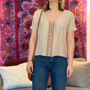 Tan shirt with orange and silver beading